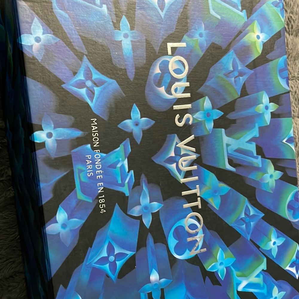 Brand new authentic Louis Vuitton clear mens sneaker. Size 9 paid 800 for them